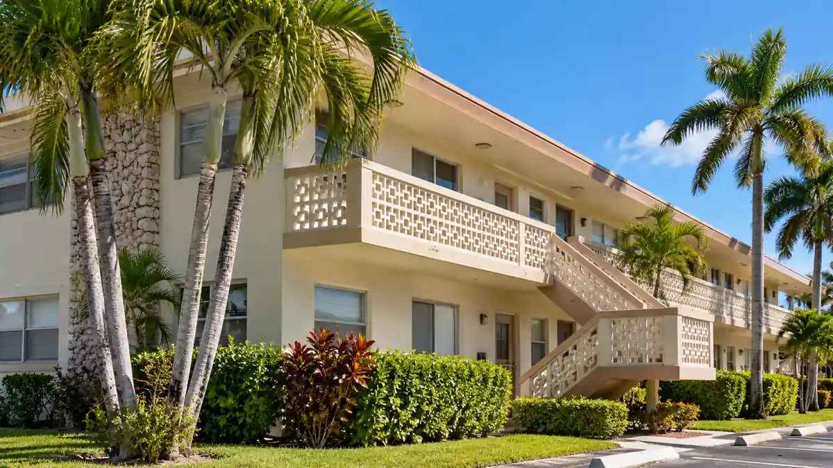 Mid-century low-rise commercial building with palm trees in Broward County