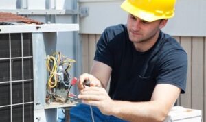 electrician repairing HVAC electrical wiring